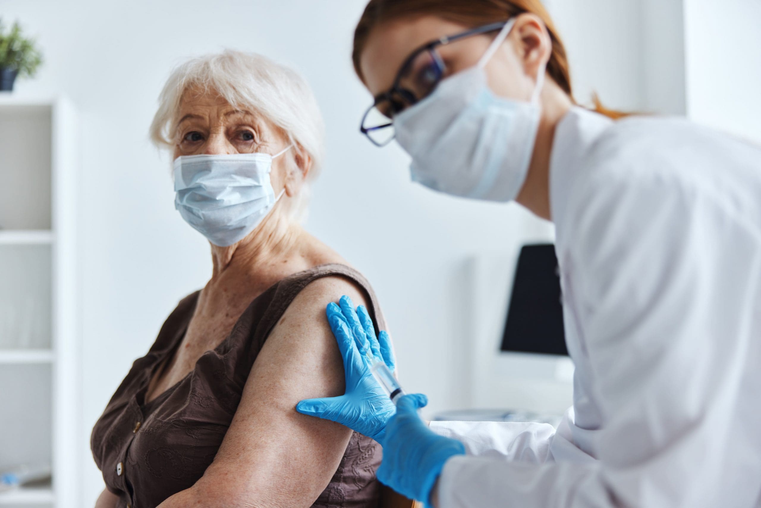 elderly-woman-with-a-doctor-vaccine-passport-immun-2025-03-11-13-38-14-utc-2